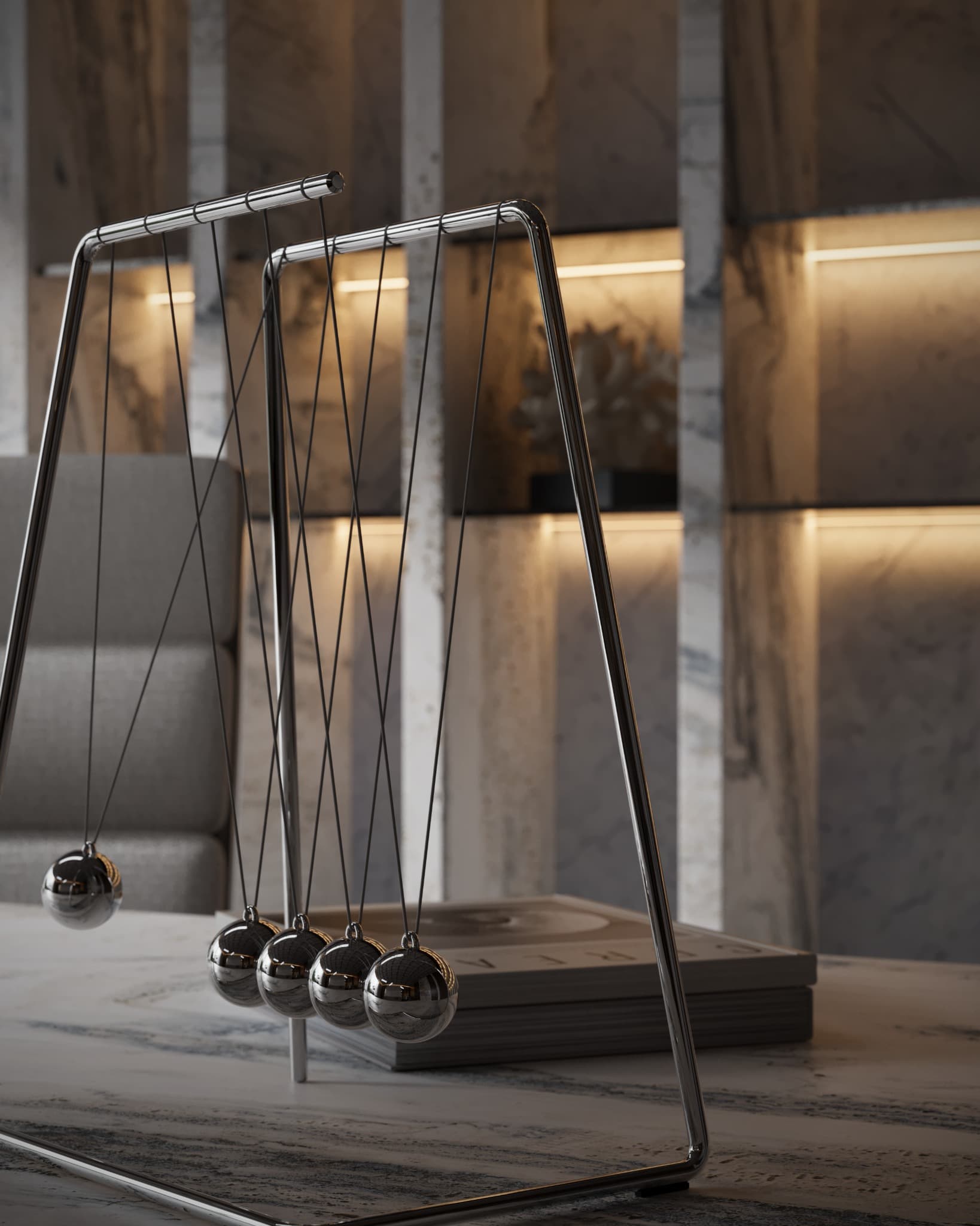 Desk object of reflective spheres suspended in a metal frame
