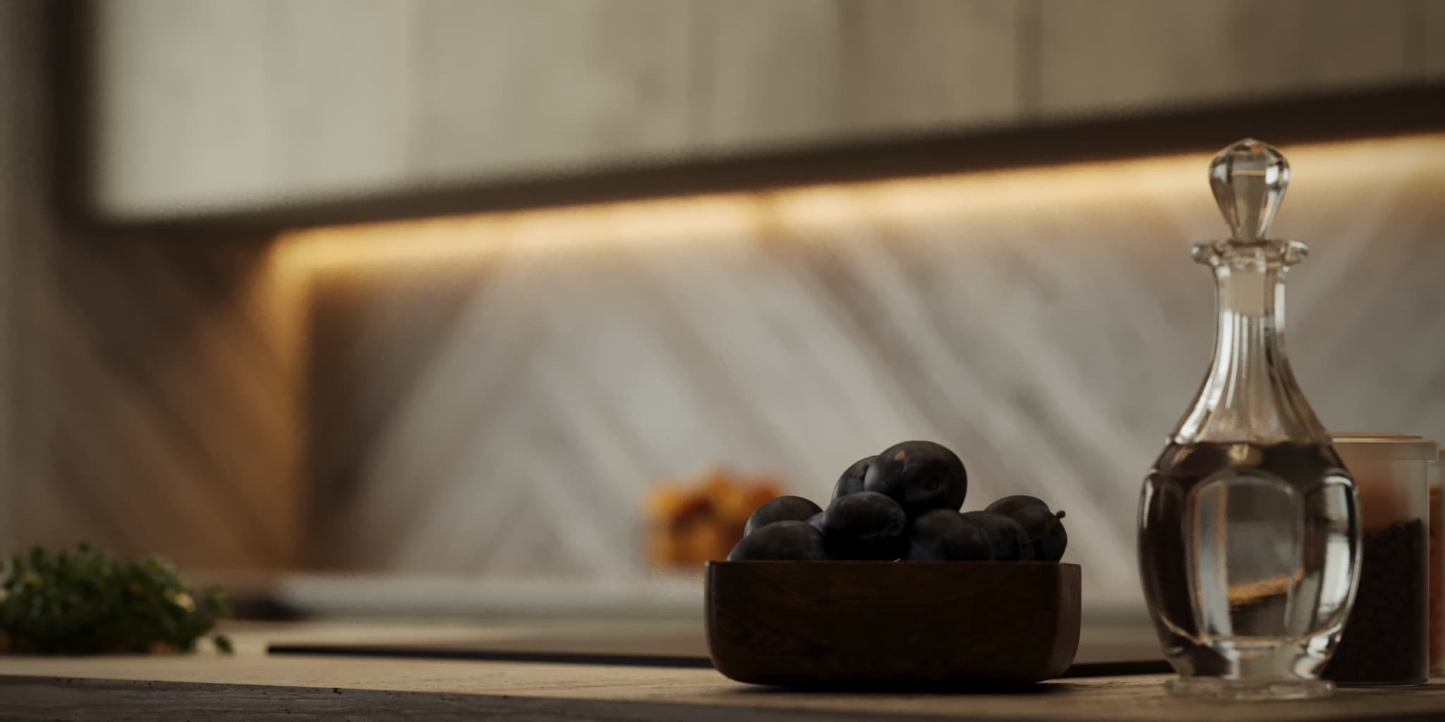 Kitchen counter with glass decanter, dark bowl and veined stone