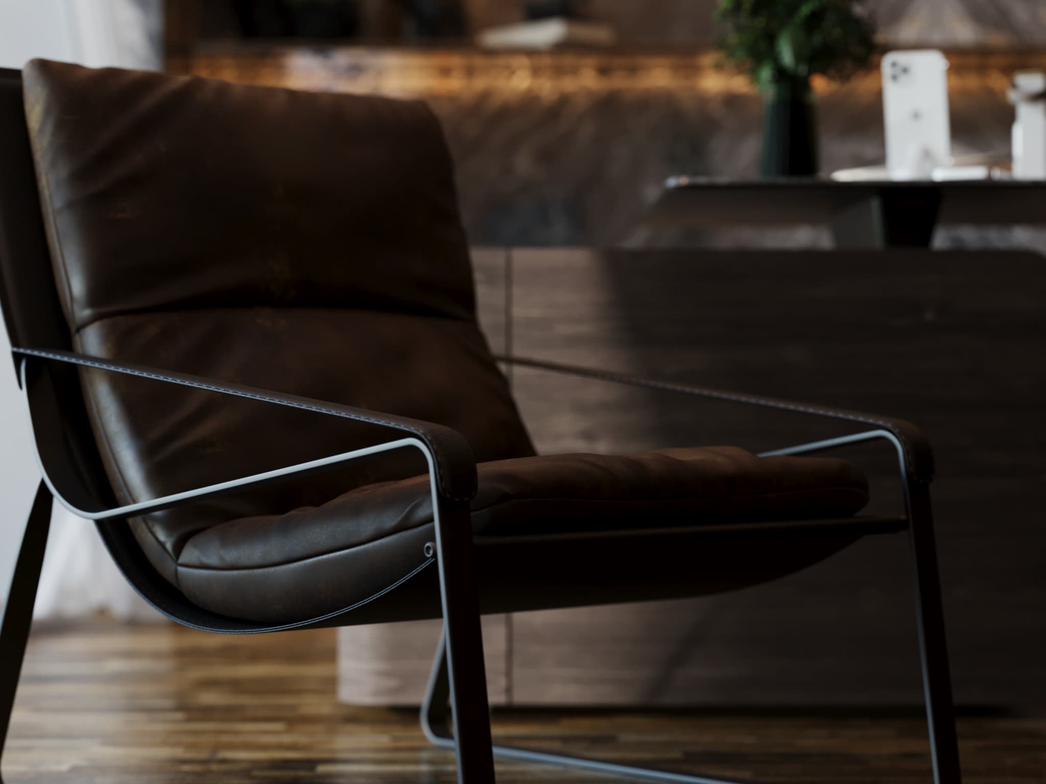 Close view of a dark upholstered visitor chair with slim metal frame