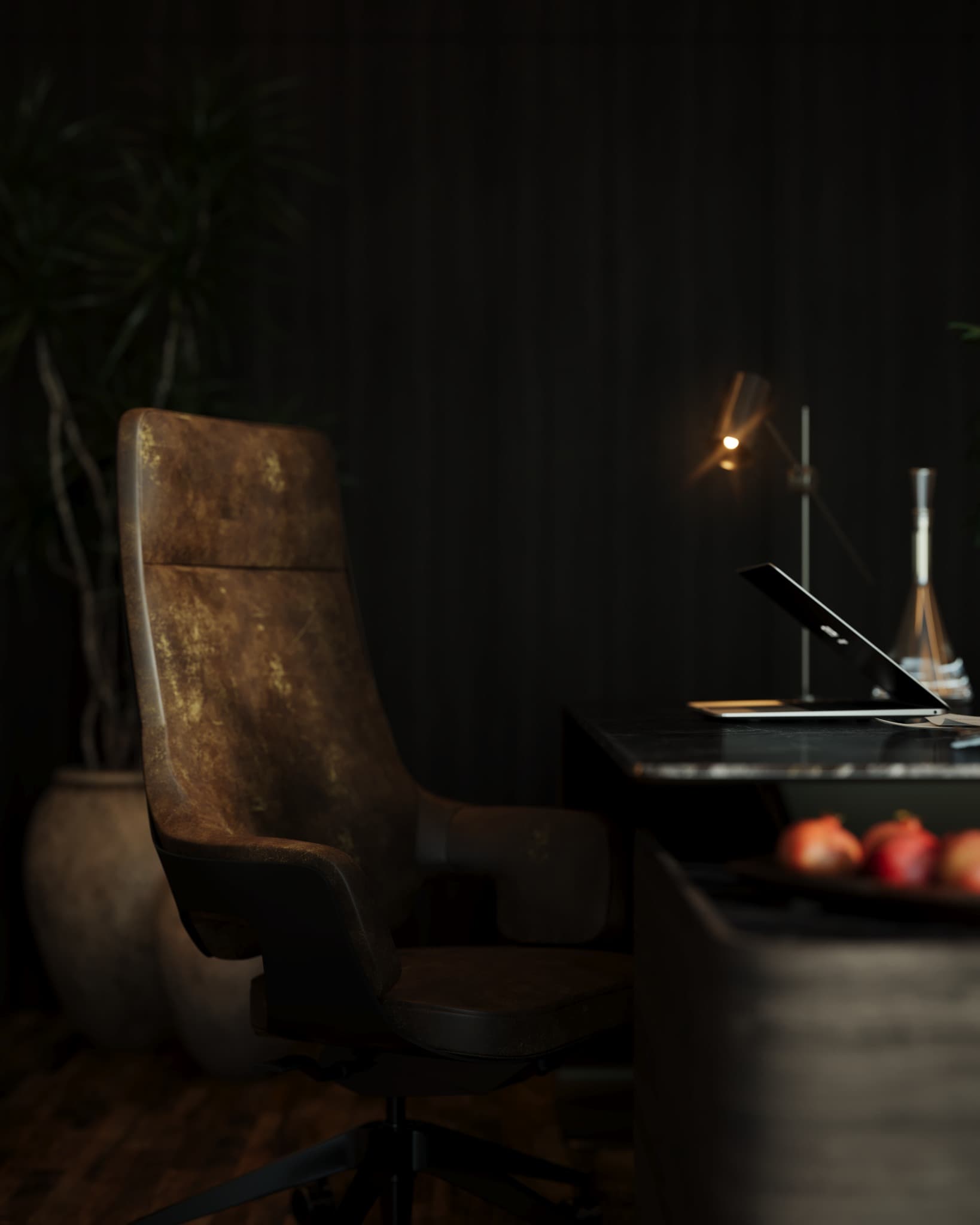 Executive chair beside the desk in a small pool of task light