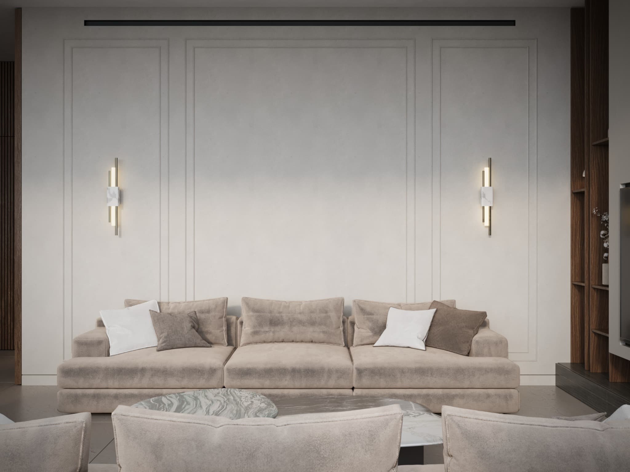 Front-facing sofa view showing fine wall mouldings and paired sconces