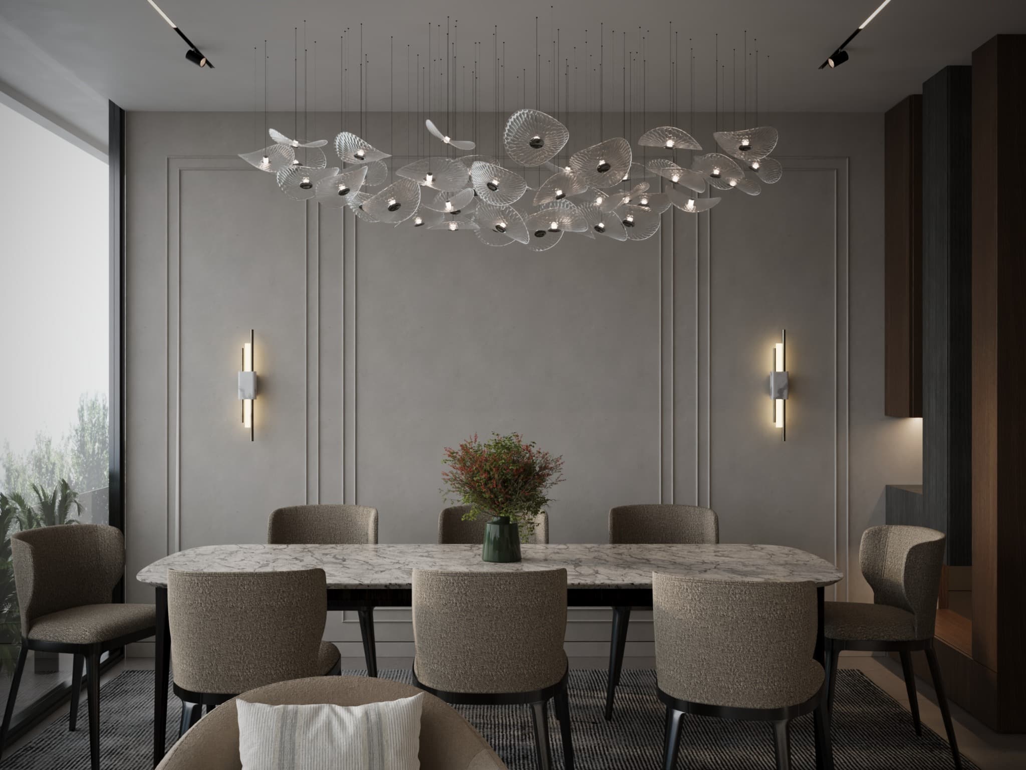 Dining table beneath a cluster of translucent glass discs