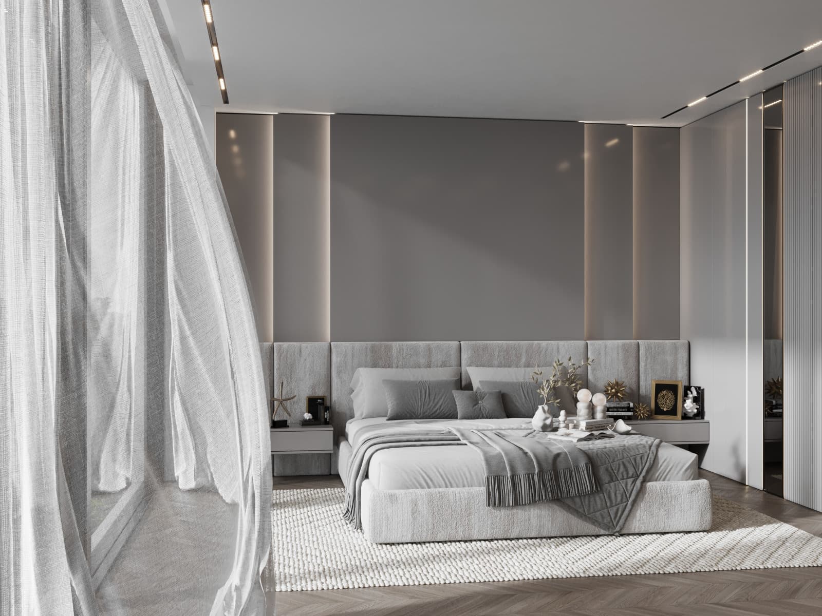 Oblique bedroom view with sheer curtains in the foreground and layered bedding beyond